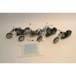 Four unboxed 'Midnight Riders' model bikes with certificates