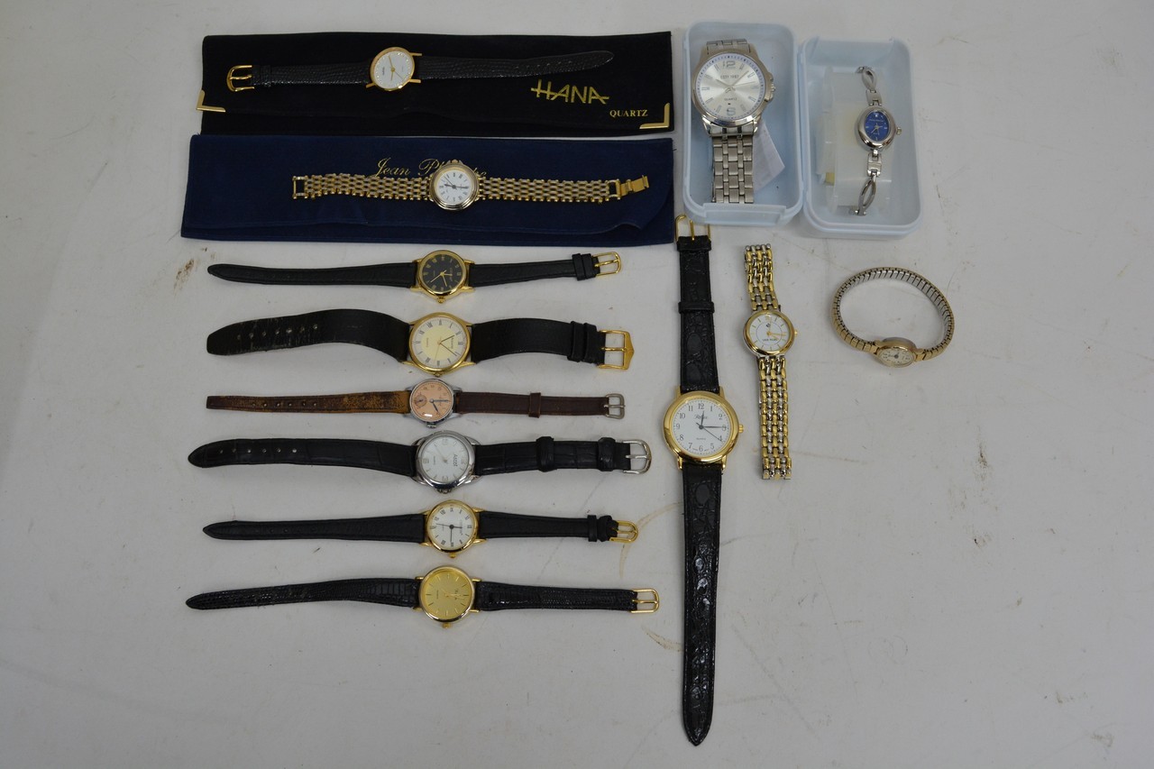 A box of various wristwatches.