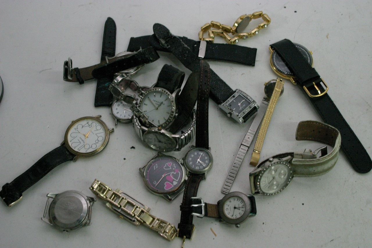 A collection of various watches and watch parts.