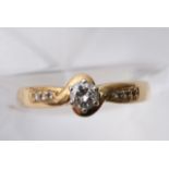 A 9ct Gold Ring with inset clear stones, size O / P