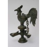 An early 20th Century Sri Lankan butter lamp in the form of a cockerel, approx height 29cm.