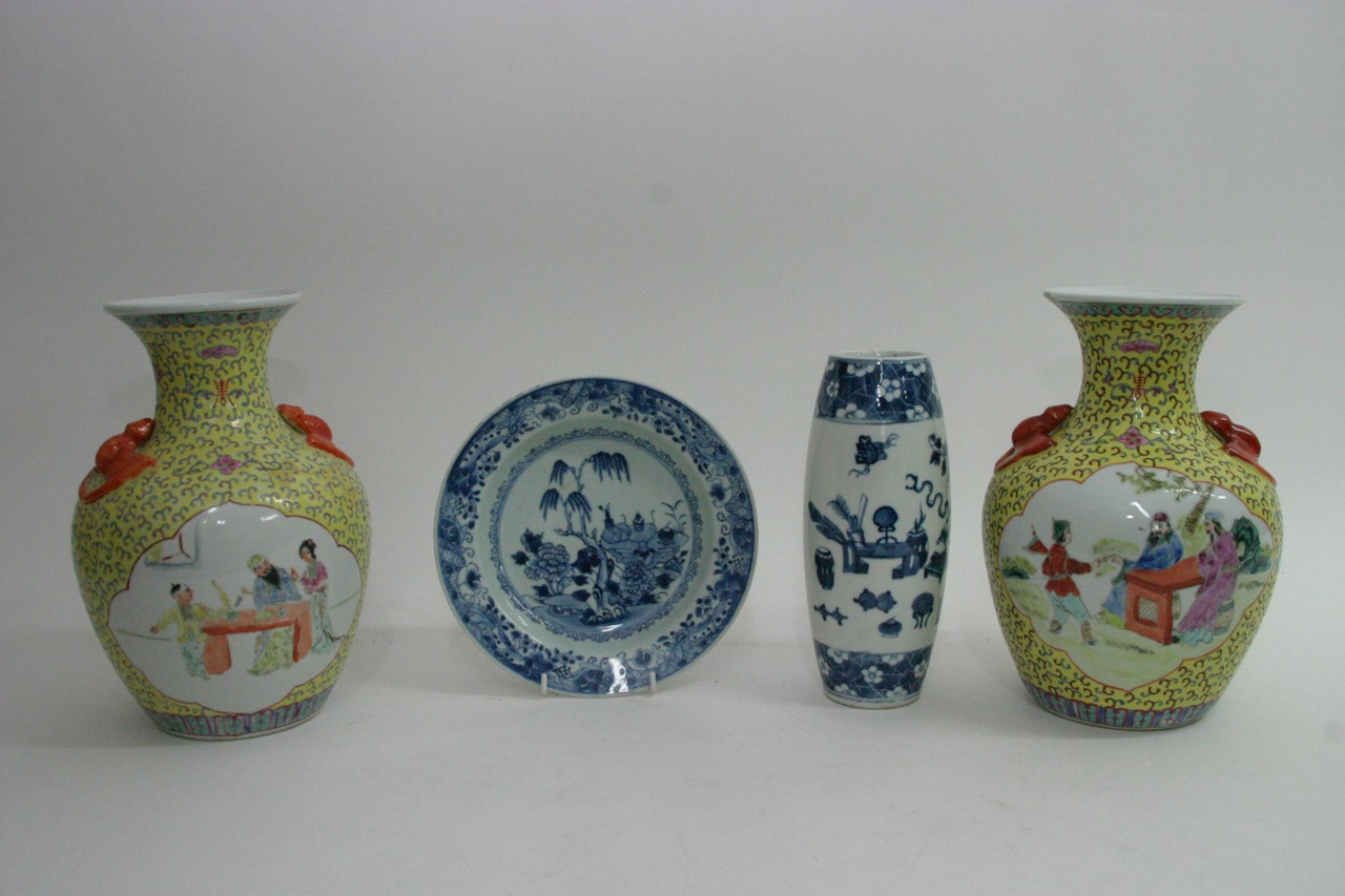A small group of Chinese ceramics comprising a pair of Famille Jaune vases painted with figural