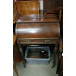 An Edwardian Rosewood cylinder bureau with a well