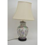 An Oriental vase of baluster form converted in to a table lamp, 70cm with shade.