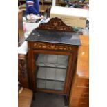 An inlaid Edwardian display cabinet, approx 123cm x 55cm x 31.5cm.