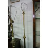 A brass standard lamp with turned support.