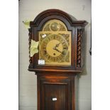 An oak longcase clock with barley twist supports fitted with a three train movement, height 165cm