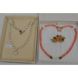 A rock crystal necklace plus a coral necklace and brooch set (2).