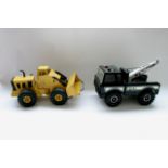 An unboxed tonka toys breakdown lorry together with an unboxed mighty loader