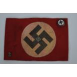 A German WW2 Style Armband and party badge depicti