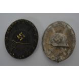 Two German WW2 Style Wound Badges, one in black an