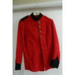 An old Scarlet army tunic with faded paper label i