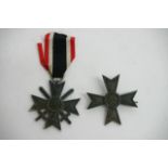 Two German WW2 style war merit crosses of 1st and