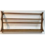 An Errol light wood plate rack.Approximately 96x49