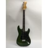 A 1979 USA Fender Stratocaster in green with a bla