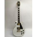 An Epiphone Les Paul custom electric guitar in whi