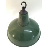 A green enamel industrial ceiling lamp.Approximate