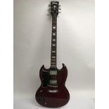 A left handed Vintage SG copy electric guitar in r