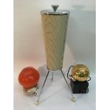 A retro tripod ashtray and two globular lamps