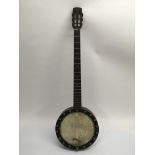 A cased banjo marked J.F. Dawson with hard case.