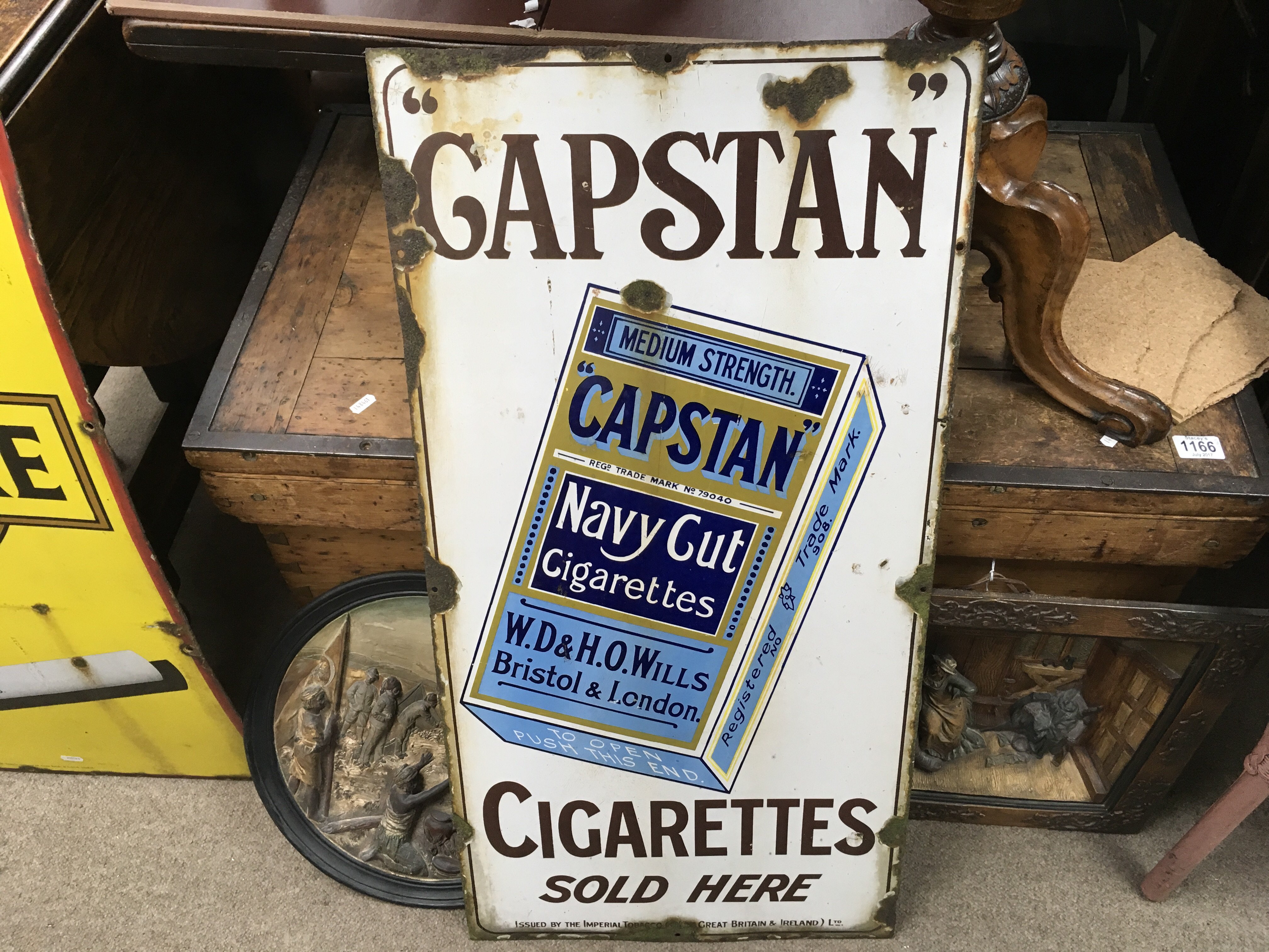 A large portrait enamel sign advertising Capstan c
