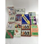 A collection of vintage board games and a box of c