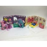 A collection of My Little Pony items including gro