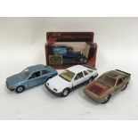 Four model cars with examples from Matchbox and Co