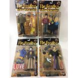 A collection of 4 carded Beatles Yellow Submarine figures