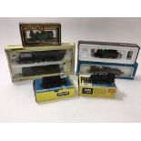 A box containing a collection of boxed model railw