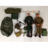 2 action man figures, one dressed as a nazi in ful