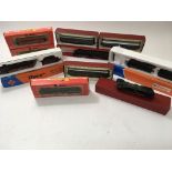 A collection of boxed locomotives and carriages in