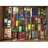 A box containing a collection of unboxed Matchbox 1-75 series model vehicles