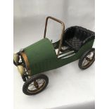 A child's green pedal car