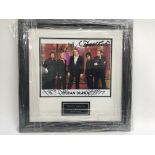 A signed and framed photograph of Duran Duran.