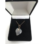 A 9ct yellow gold early agate heart shaped pendant