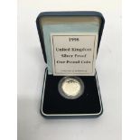 A cased 1998 United Kingdom silver proof £1 coin.