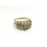 A 14ct yellow gold ring inset with two rows of gra