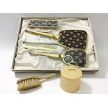 A boxed vintage brush and mirror set alongside a '