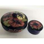 A Moorcroft Hibiscus pattern trinket box and a sma