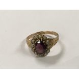 An Antique 9ct gold ring set with an oval cut amet