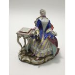 A 19th Century Meissen figure of a lady seated at