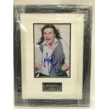 A signed and framed photograph of Meatloaf.