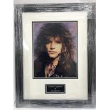 A signed and framed photograph of Jon Bon Jovi.