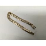 A 9ct gold slab link bracelet. Weight approx 13.4g