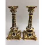 A pair of Royal Crown Derby candlesticks in Imari pattern, height approx 27cm.