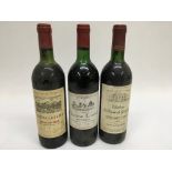 3 bottles of red wine. A Chateau La Fleur, a Chate