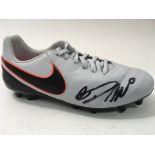 A Nike football boot signed by Christiano Ronaldo