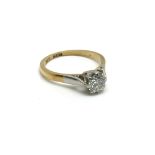 An 18ct yellow gold and platinum ring inset with a