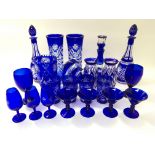 A collection of blue flash cut glass to include th